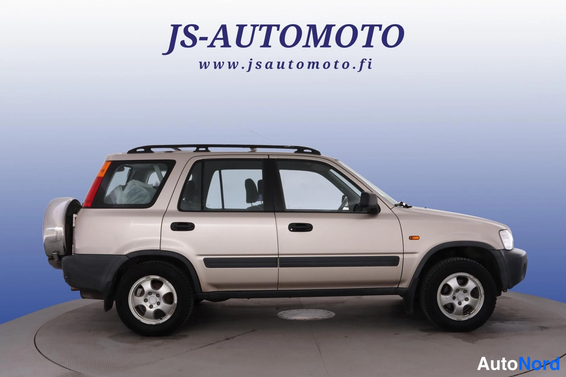 Beige Honda CR-V 1999, från sidan, bild 4