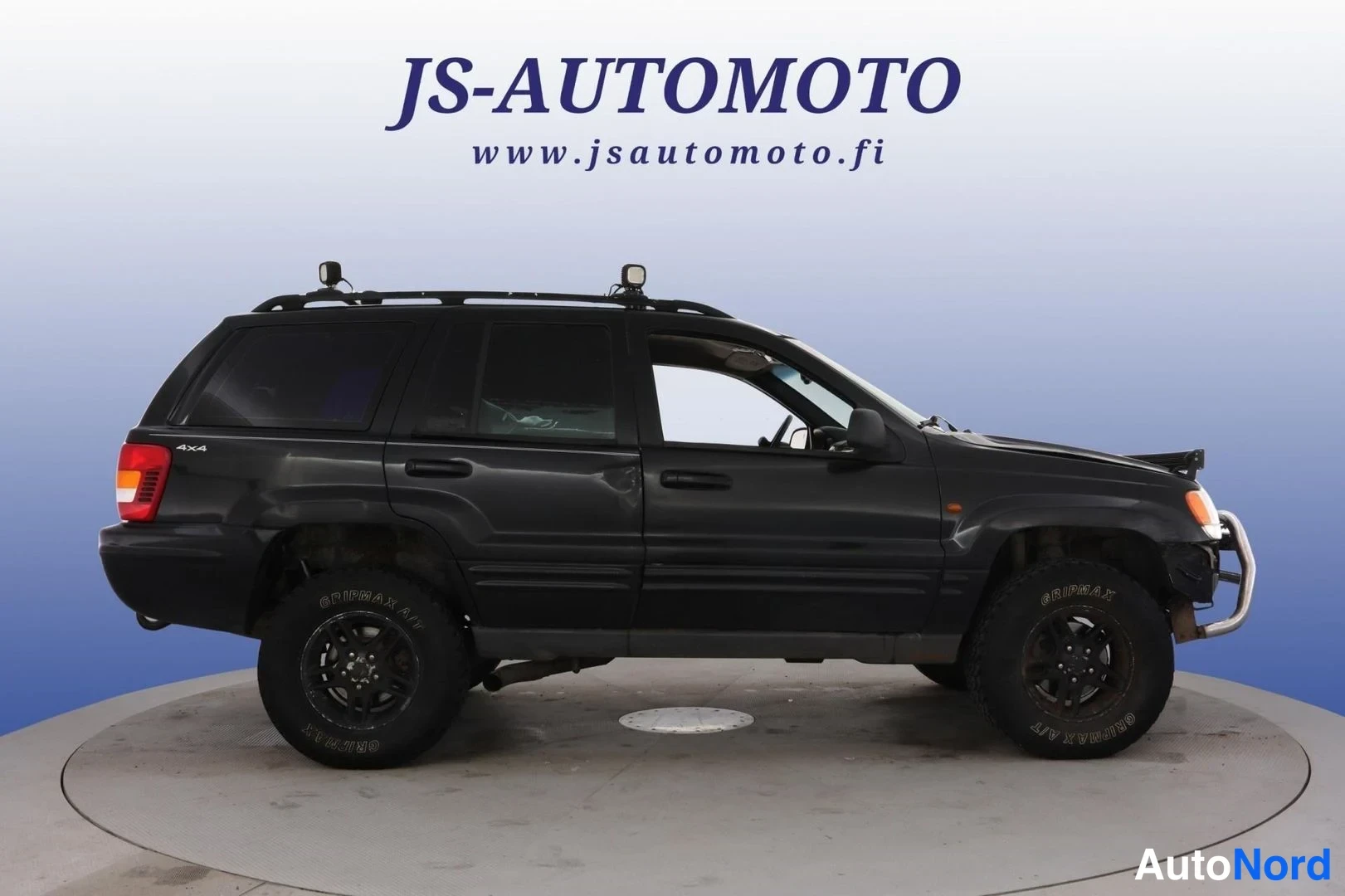 Svart Jeep Grand Cherokee 2000, från sidan, bild 4