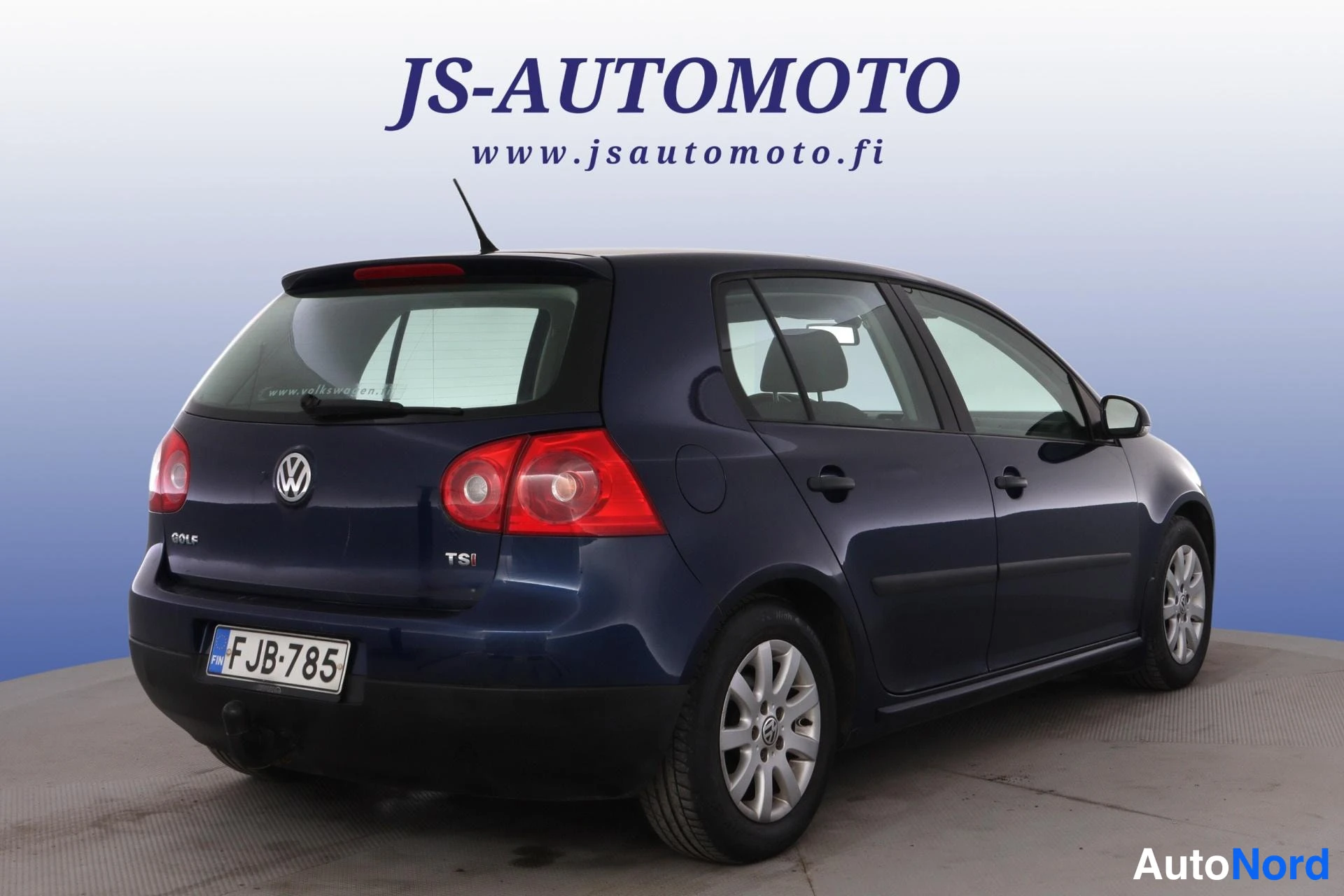 Blå Volkswagen Golf 2009, snett bakifrån, bild 5
