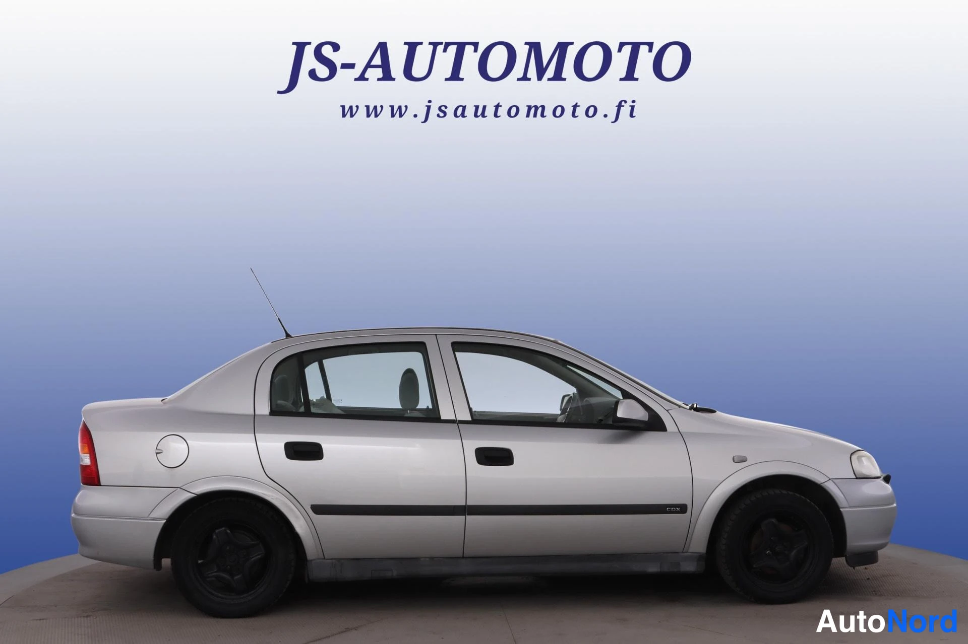 Grå Opel Astra 1998, från sidan, bild 3