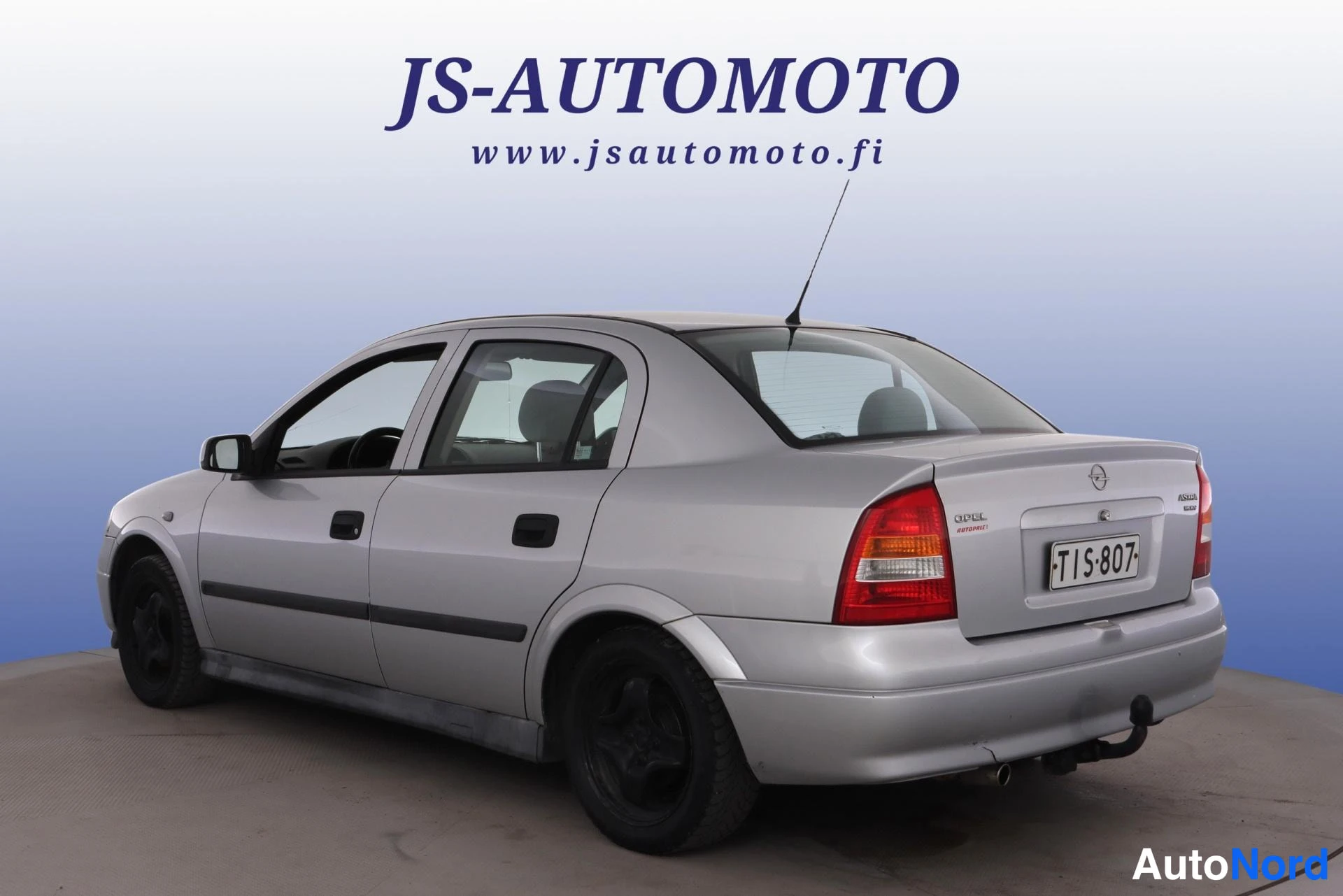 Grå Opel Astra 1998, snett bakifrån, bild 6
