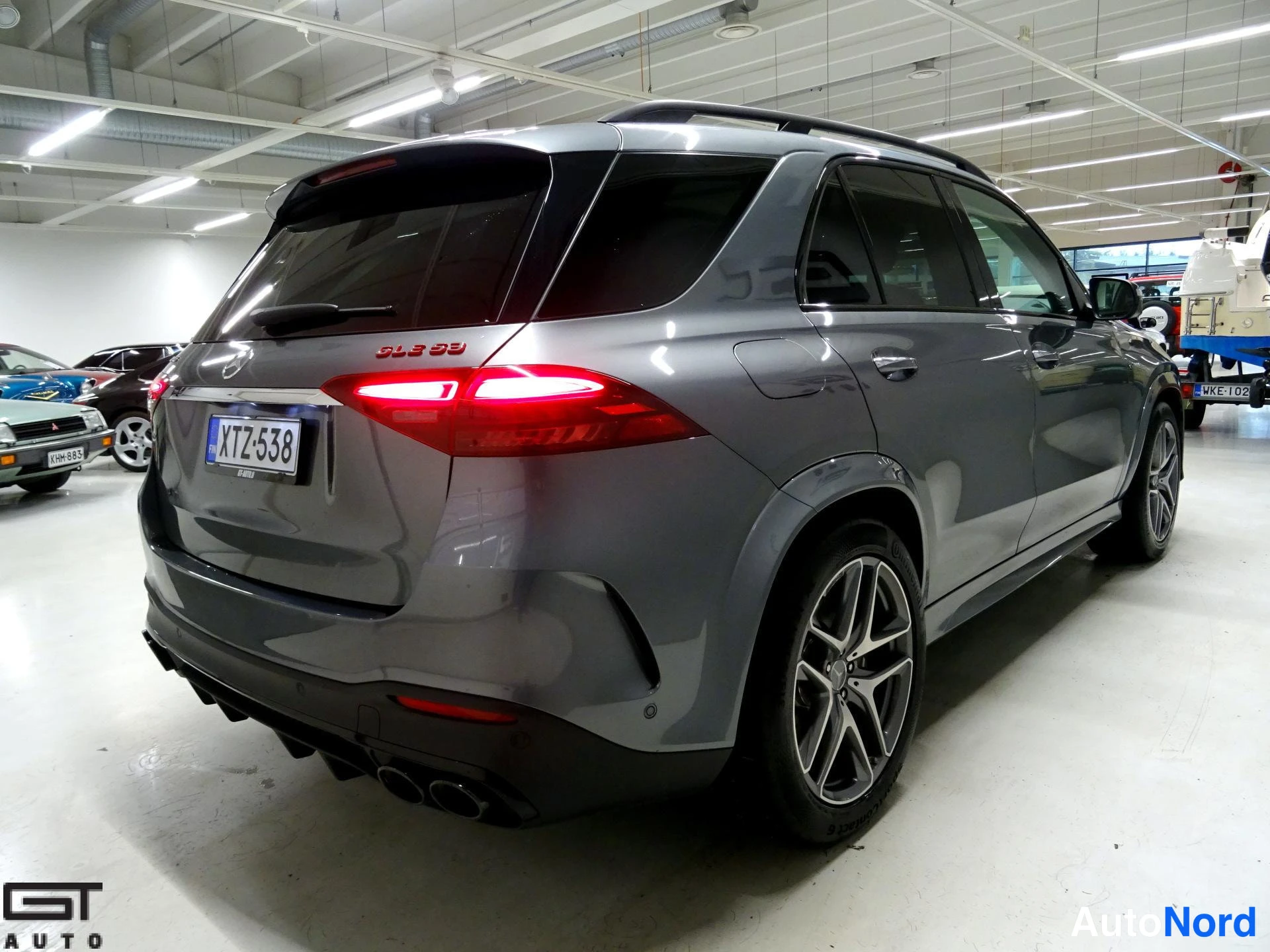 Grey Mercedes-Benz GLE 53 2024, rear three-quarter, photo 11