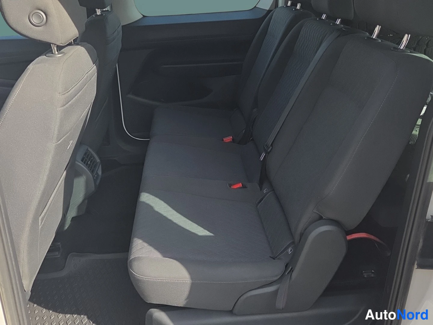 White Volkswagen Caddy 2024, rear seats, photo 9