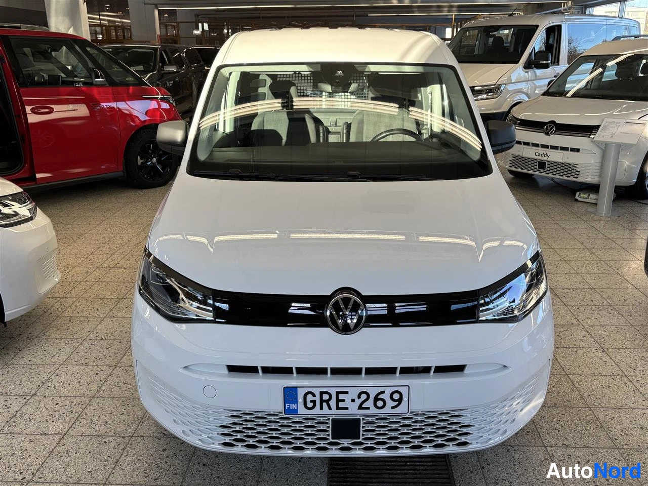 White Volkswagen Caddy 2025, front, photo 3
