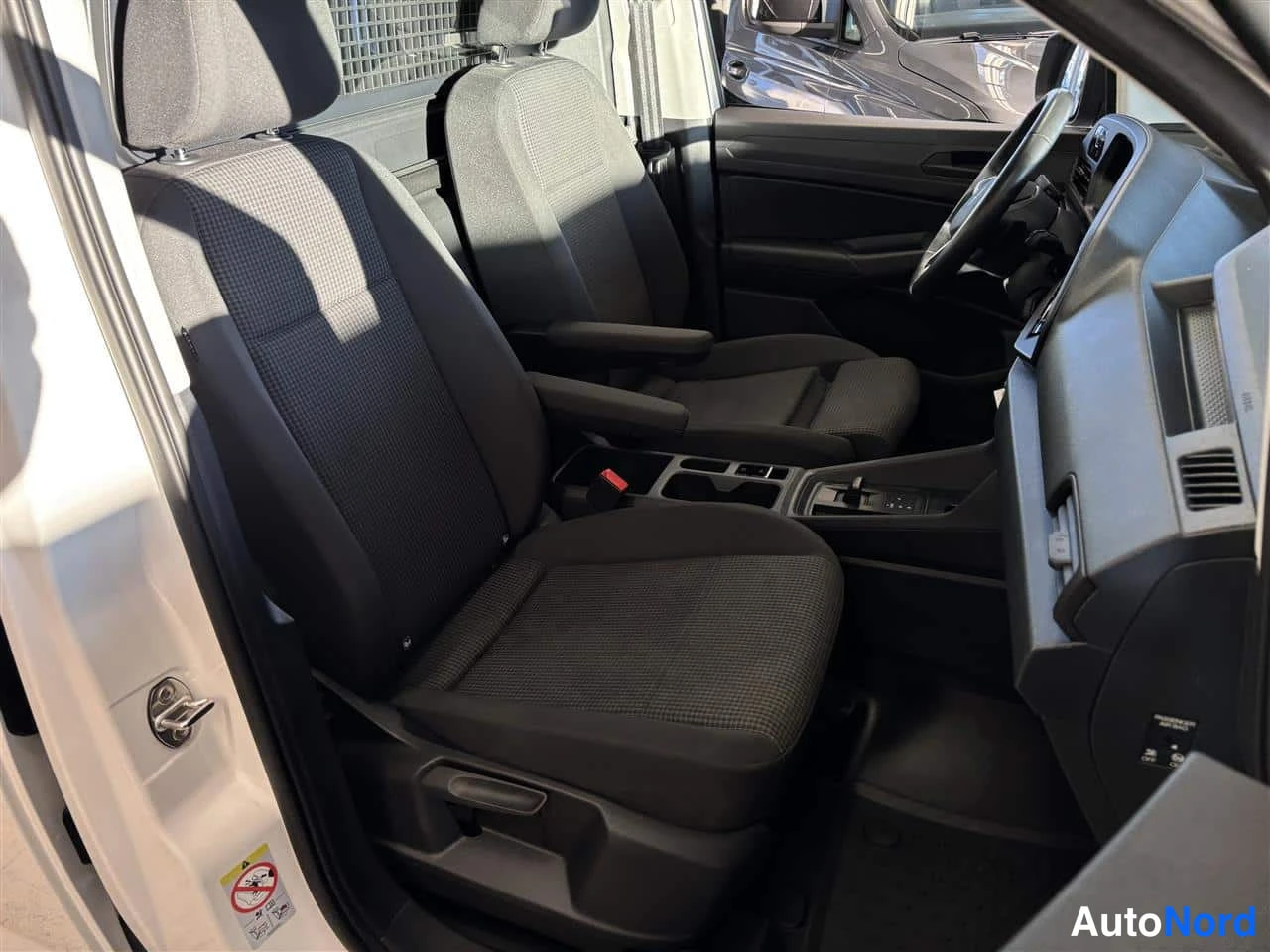 White Volkswagen Caddy 2025, front seats, photo 11