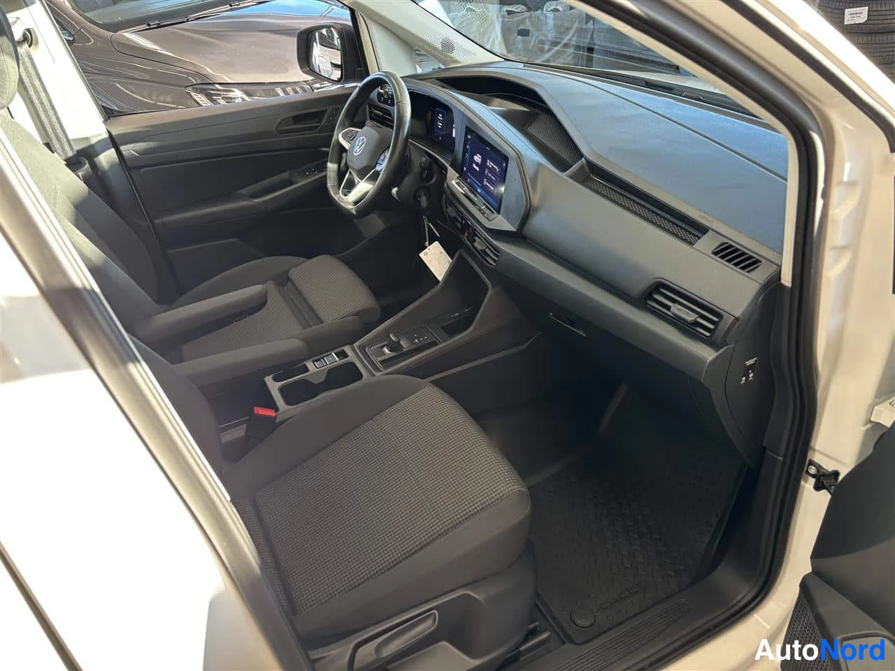 White Volkswagen Caddy 2025, cockpit, photo 8
