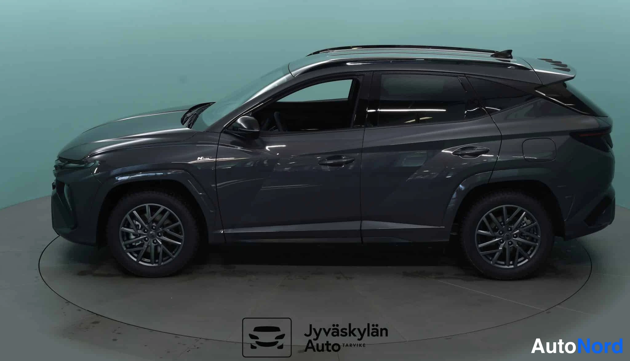 Harmaa Hyundai Tucson 2026, sivulta, kuva 13