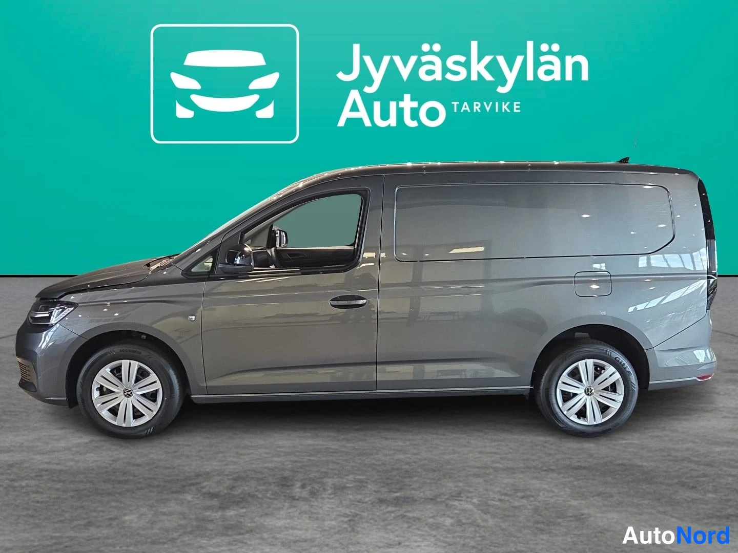 Grå Volkswagen Caddy 2026, från sidan, bild 3