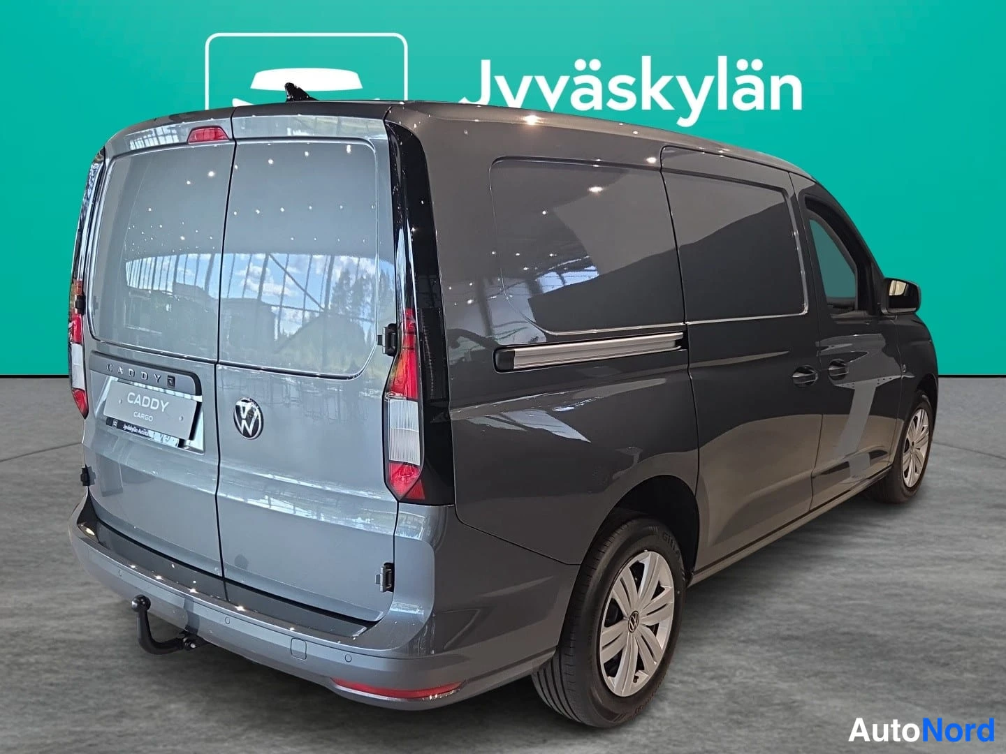 Grå Volkswagen Caddy 2026, snett bakifrån, bild 5