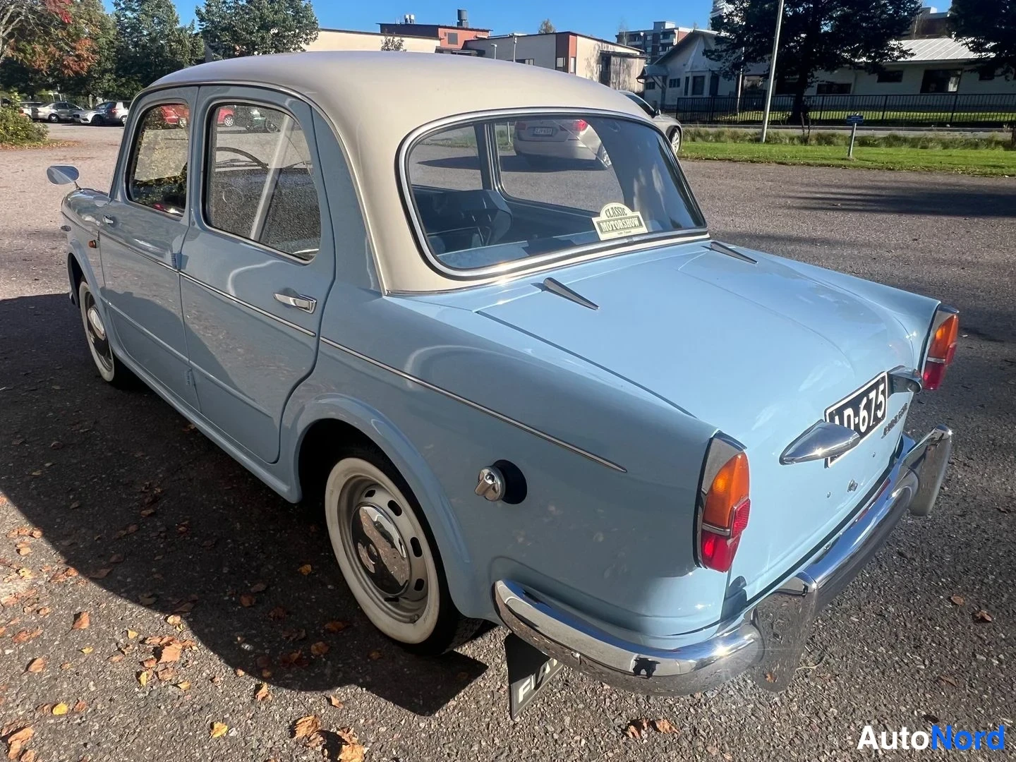 Blå Fiat 1100 1960, snett bakifrån, bild 10