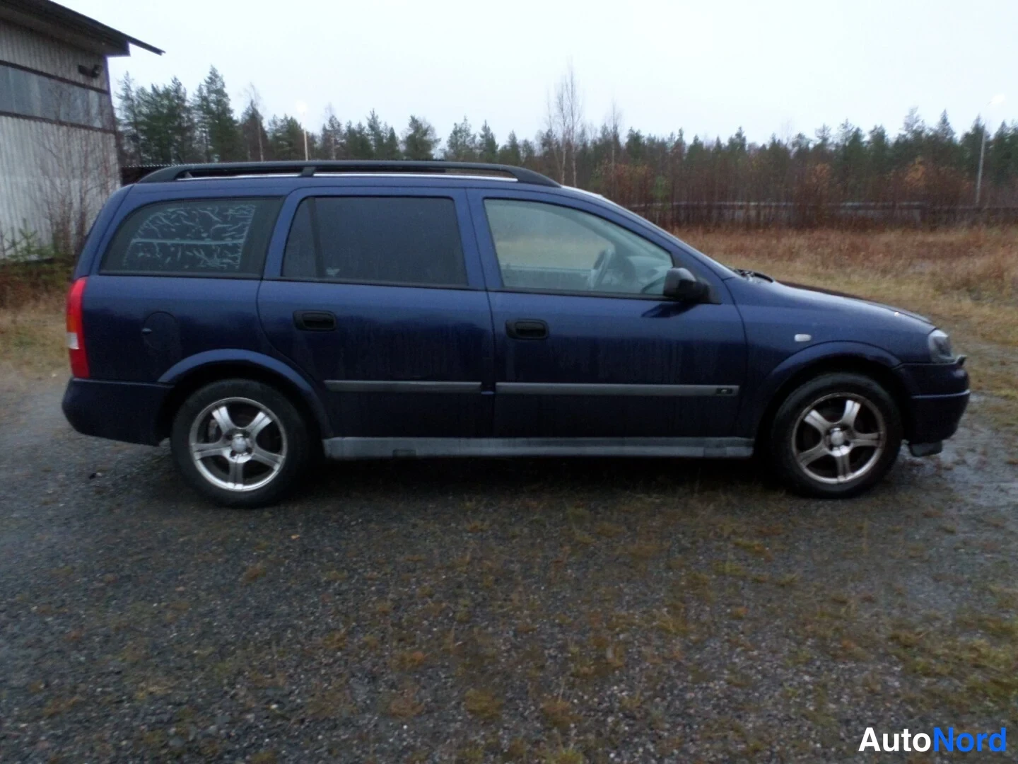 Sininen Opel Astra 1999, sivulta, kuva 4