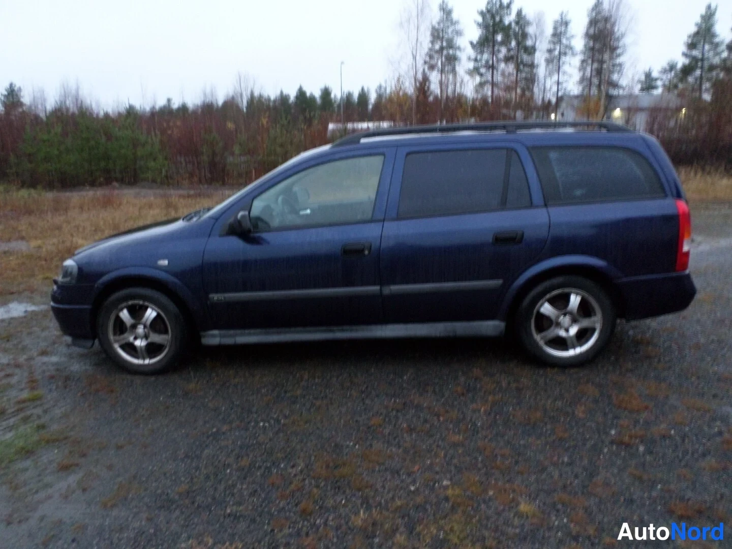 Sininen Opel Astra 1999, sivulta, kuva 5