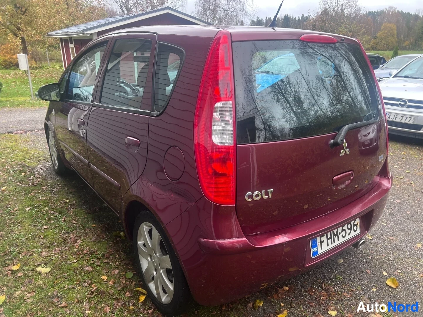 Red Mitsubishi Colt 2006, rear three-quarter, photo 3