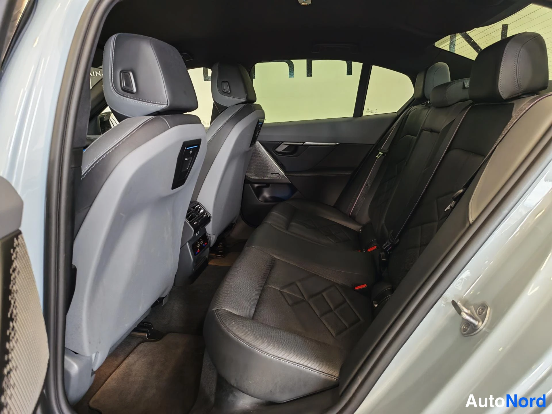 Grey BMW i5 2024, rear seats, photo 15