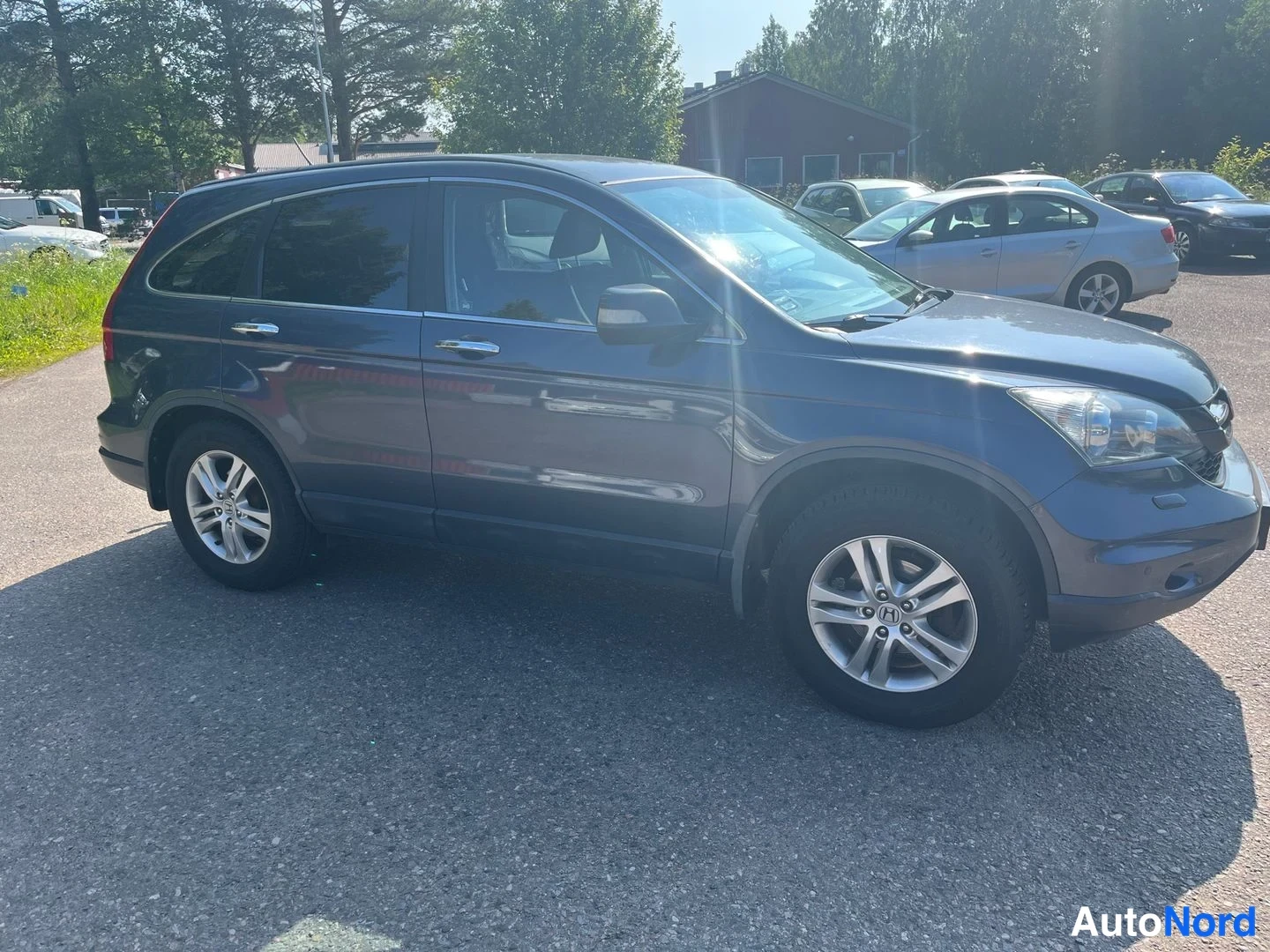 Sininen Honda CR-V 2012, sivulta, kuva 3