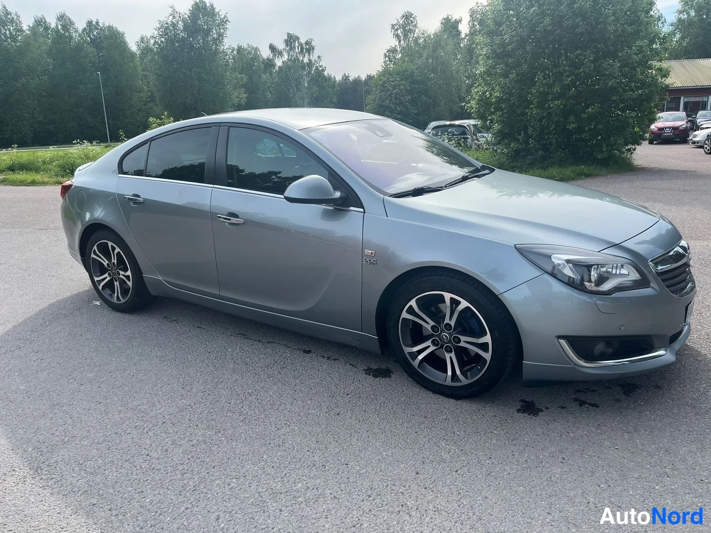 Sininen Opel Insignia 2014, etuviisto, keula oikealle, kuva 2