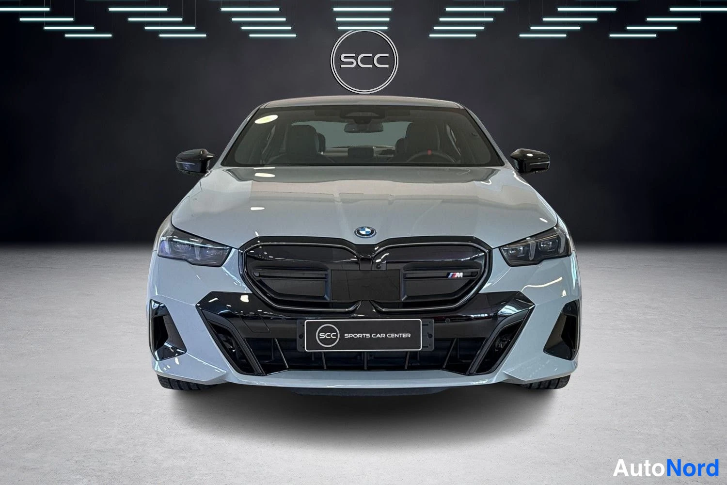 Grey BMW i5 2024, front, photo 2