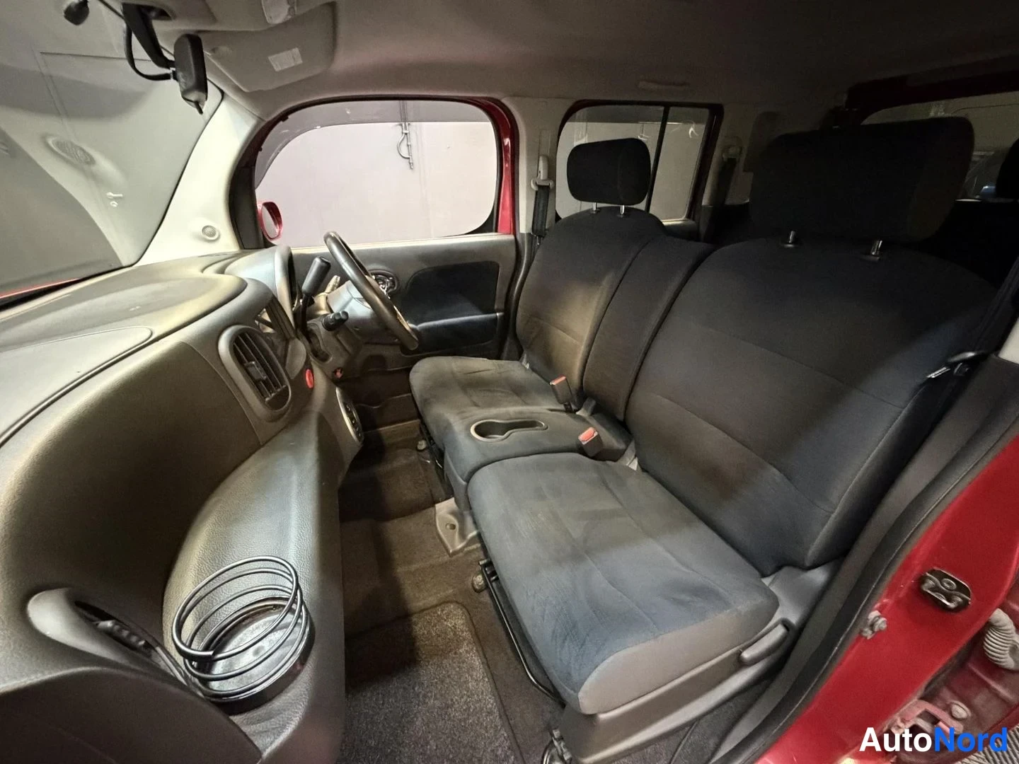 Röd Nissan Cube 2008, förarplats, bild 16