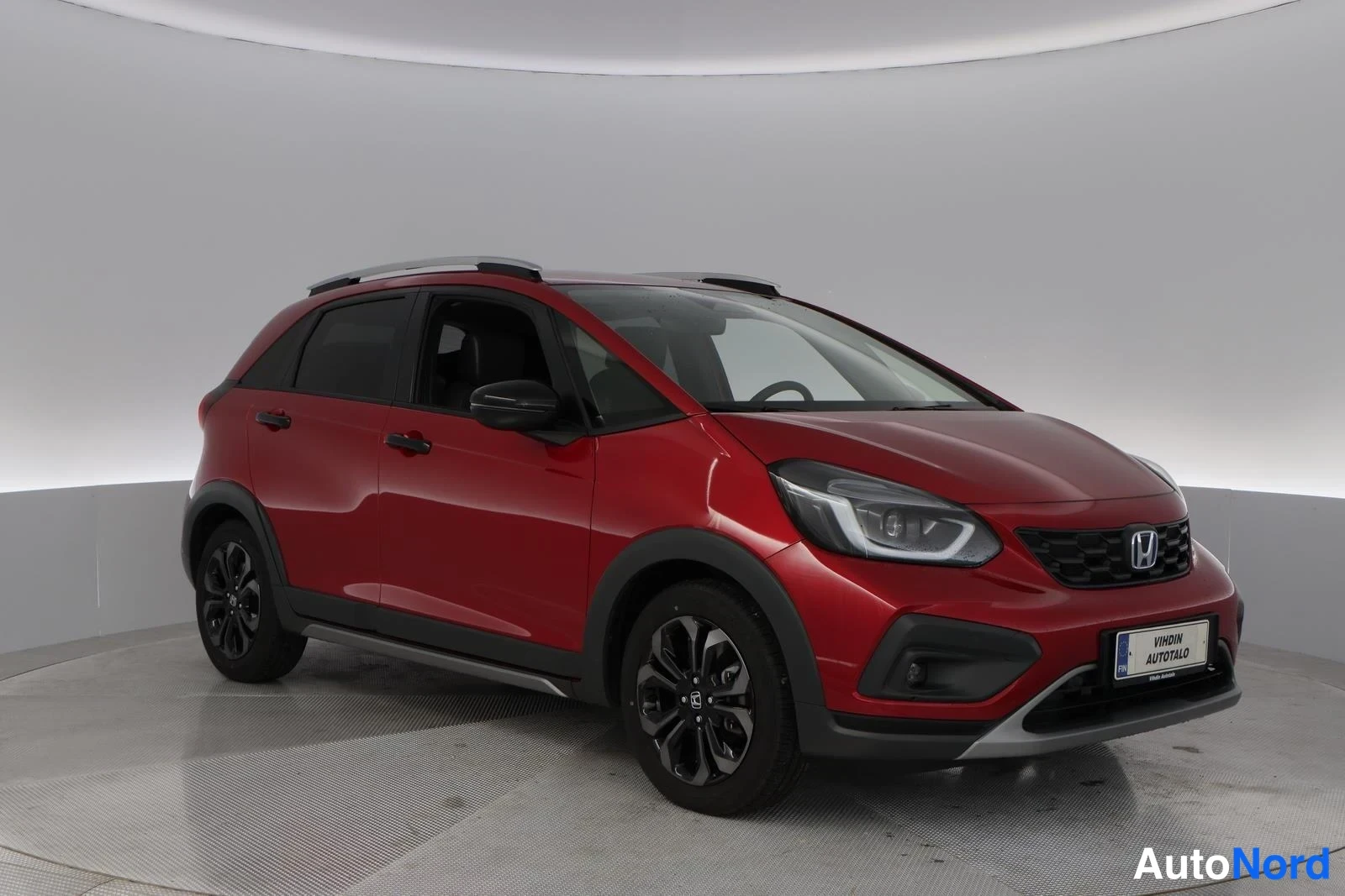 Red Honda Jazz 2025, front three-quarter, nose to the right, photo 4