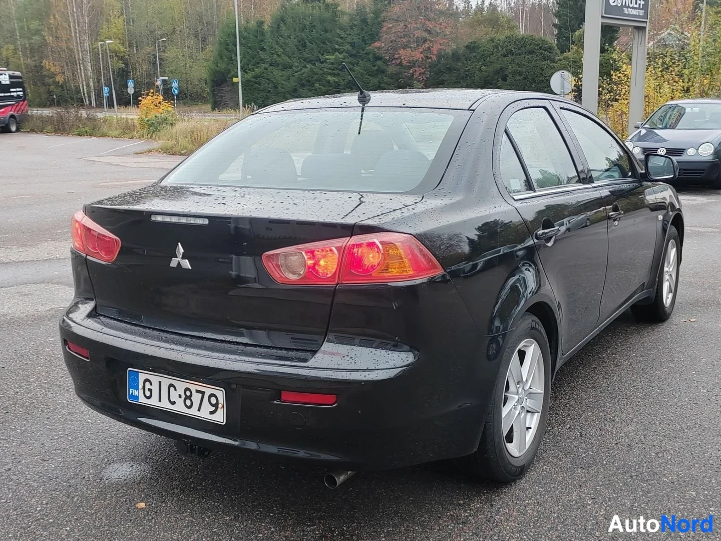 Svart Mitsubishi Lancer 2008, bakifrån, bild 7
