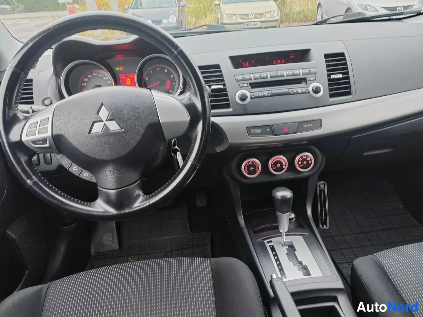 Svart Mitsubishi Lancer 2008, förarplats, bild 8